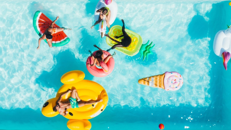Group of adults smiling in a pool