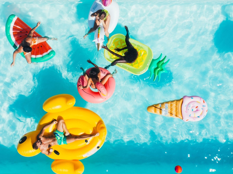 Group of adults smiling in a pool